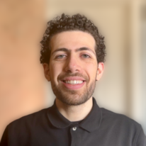 Jad, wearing a black polo shirt.
